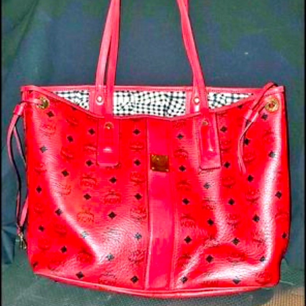 Red MCM shoulder tote bag with mini red mcm purse inside. It sits in my closet.